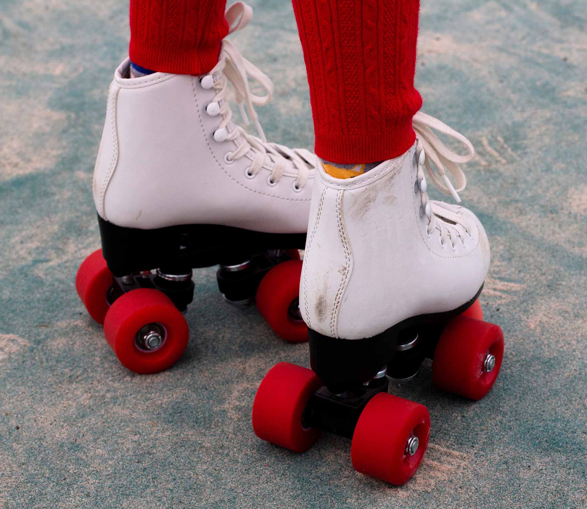 A child's red wheels roller skate